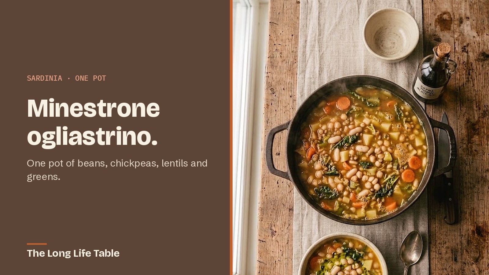 Overhead view of a pot of Sardinian minestrone with beans, chickpeas, lentils and greens, with a bowl and a bottle of olive oil