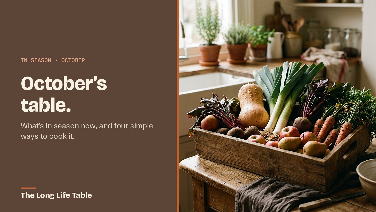 A wooden crate of October produce: butternut squash, leeks, beetroot, carrots, apples and pears
